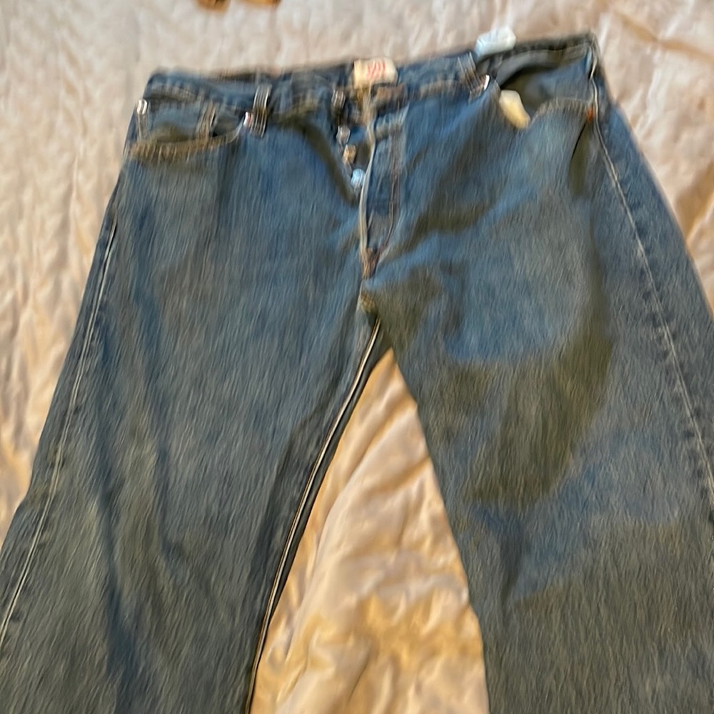 Used Levi 501’s for sale, back badge torn.  Only issue